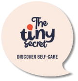Round beige coaster with 'The tiny secret' logo and text on a white background