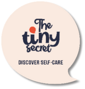 Round beige coaster with 'The tiny secret' logo and text on a white background